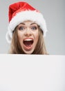 Close up christmas woman portrait behind big white card. Emotio Royalty Free Stock Photo