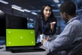 Close up of chroma key notebook used by workers overseeing data center