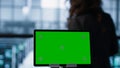 Close up of chroma key tablet and teamworking programmers in server room