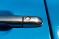 Close-up of chrome door handle of blue car. Royalty Free Stock Photo