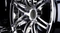 Close up of chrome wheel on black car with chrome spokes. Generative AI