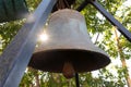 Close-up of church bell in the rays of the setting sun