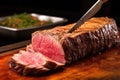 close-up of churrasco being sliced with a long knife