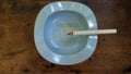 Close-up Cigarette Burning in Ashtray: A Captivating Top-Down Perspective Royalty Free Stock Photo