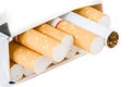 Close-up of cigarettes in pack isolated on white background. Royalty Free Stock Photo