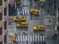 CLOSE UP: Cinematic shot of a bustling road junction in NYC on a cold rainy day