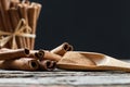 Close up cinnamon sticks and cinnamon powder in wooden spoon  on wooden table background Royalty Free Stock Photo