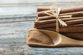 Close up cinnamon sticks and cinnamon powder in wooden spoon  on wooden table background Royalty Free Stock Photo