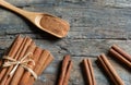 Close up cinnamon sticks and cinnamon powder in wooden spoon on wooden table background Royalty Free Stock Photo