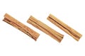 Close up of cinnamon sticks isolated on white background, top view. Three cinnamon sticks. Ceylon cinnamon Royalty Free Stock Photo