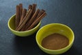 Cinnamon sticks and powder in a bowl Royalty Free Stock Photo