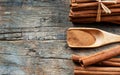 Close up cinnamon sticks and cinnamon powder in wooden spoon on wooden table background Royalty Free Stock Photo