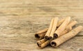 Close up of cinnamon sticks on rustic wood