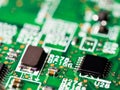 Close-up of circuit board with integrated circuits, resistors and capacitors Royalty Free Stock Photo