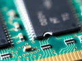 Close-up of circuit board with integrated circuits, resistors and capacitors Royalty Free Stock Photo