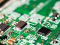 Close-up of circuit board with integrated circuits, resistors and capacitors Royalty Free Stock Photo