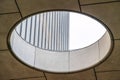 Close up of circular skylight with view of the concrete building exterior wall Royalty Free Stock Photo