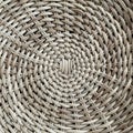 Close-up of a circular woven pattern, likely a basket or mat, made from natural fibers Royalty Free Stock Photo