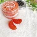 Close up citrus sugar scrub on towel  background. Royalty Free Stock Photo