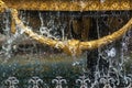 Close-up of the city fountain with gilded decor elements and dripping water, fountain in Tbilisi,