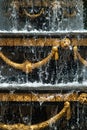 Close-up of the city fountain with gilded decor elements and dripping water, fountain in Tbilisi,