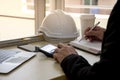 Close up of civil design engineer is making structural analysis calculations using a scientific calculator