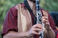 Close up of clarinet player playing at a Klezmer concert of Jewish fusion music in Regent`s Park in London Royalty Free Stock Photo