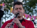 Close up of clarinetist Merlin Shepherd playing at an annual concert of Jewish Klezmer music in Regent`s Park in London UK. Royalty Free Stock Photo