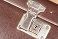 Close up of a clasp of an old fashioned suitcase