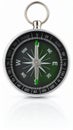 Close-up of a classic compass showing direction, silver ring, green dial and reflection Royalty Free Stock Photo