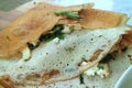 Close up of classic French savory crepe stuffed with spinach, chicken and cheese