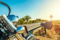 Close up of a classic motorcycle parked on the edge of a country road Royalty Free Stock Photo