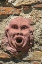 Close-up of clay mask attached to the wall in Colle di Val d`Elsa.