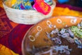 Plate of Mexican chopped lamb meat and tortilla basket on colorful tablecloth