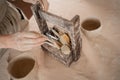 clay sculpture tools, a set of tools for carving ceramics with a wooden handle, the female hands of the craftsman take