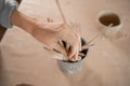 clay sculpture tools, a set of tools for carving ceramics with a wooden handle, the female hands of the craftsman take