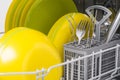 Close-up of clean metal cutlery and plates, in the dishwasher, after work Royalty Free Stock Photo