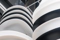 Close-up of clean plates arranged black and white in the dishwasher Royalty Free Stock Photo