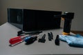 Close-up of cleaning open computer case with specialized tools, screwdrivers and brushes on gray table in workshop Royalty Free Stock Photo
