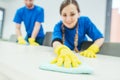 Close-up of cleaning team working in an office Royalty Free Stock Photo