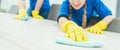 Close-up of cleaning team working in an office Royalty Free Stock Photo