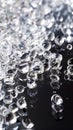 A close up of clear glass beads on a black surface Royalty Free Stock Photo