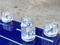 Close-up Clear knob, blue metallic metal body of Stomp box electric guitar effect for studio and stage performed on white