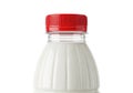Close up of a clear plastic bottle filled with white liquid and a red cap isolated on white background Royalty Free Stock Photo