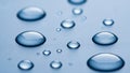 Close-up of clear water droplets on a smooth, light blue surface Royalty Free Stock Photo