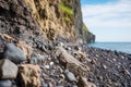 close-up of a cliffs edge with pebbles and small rocks