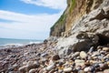 close-up of a cliffs edge with pebbles and small rocks