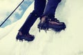 Close up of climber climbing ice mountain in mountainering  shoes Royalty Free Stock Photo