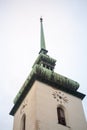 Close up on the clock tower and belfry St james Church, also called Kostel Svateho Jakuba, in Brno, Czech Republic. Royalty Free Stock Photo