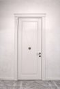 Close up of closed wooden door in the empty room Royalty Free Stock Photo